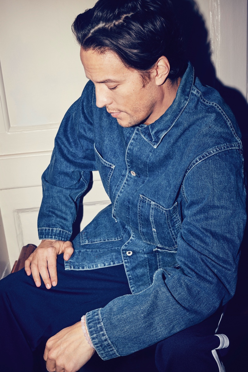 Making a case for workwear-inspired style, Cary Joji Fukunaga wears a Chimala distressed selvedge denim chore jacket.