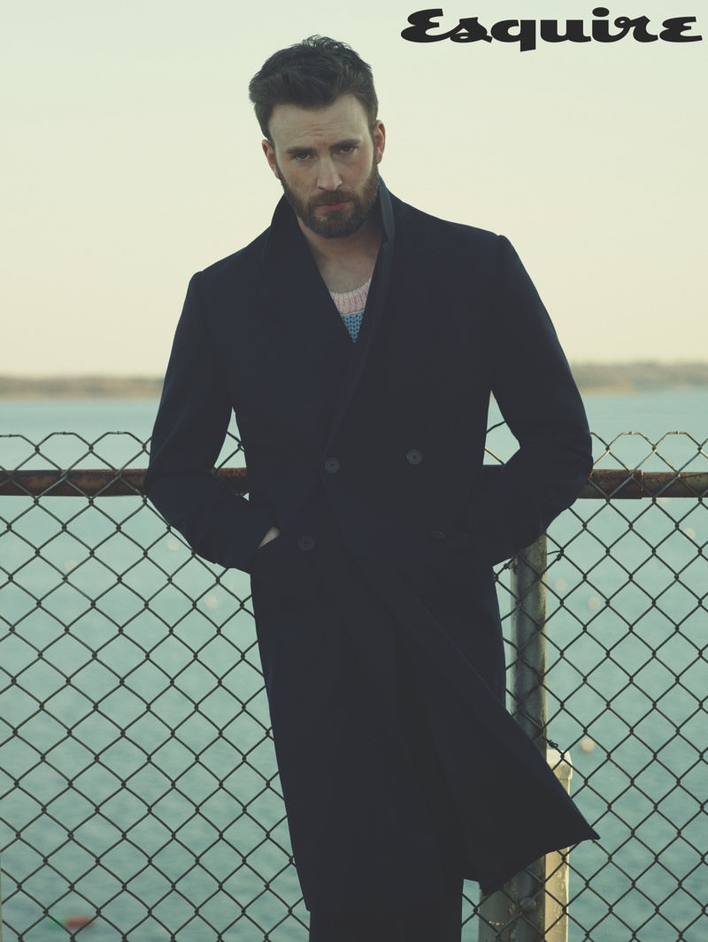 Linking up with Esquire for its April/May 2020 issue, Chris Evans sports a sweater, coat, and pants by Prada.