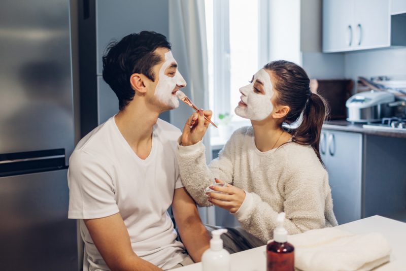 Couple Applying Face Masks