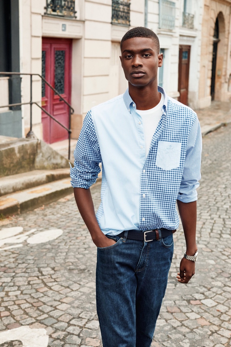 Taking to the streets of Paris, Rachide Embalo stands out in a colorblock shirt for GANT's spring 2020 campaign.