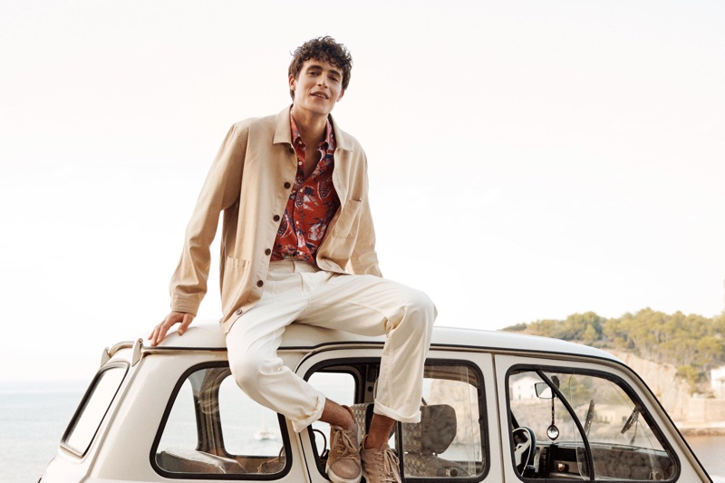 Oscar Kindelan is a smart vision in a workwear-inspired jacket and tropical print shirt for GANT's spring-summer 2020 campaign.