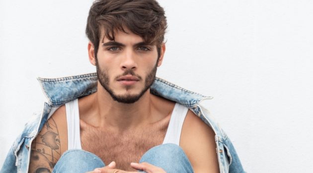 Gustavo Doubles Down on Denim for a Stylish Update Model Gustavo Grellet sits for a portrait lensed by photographer Matheus Pereira.