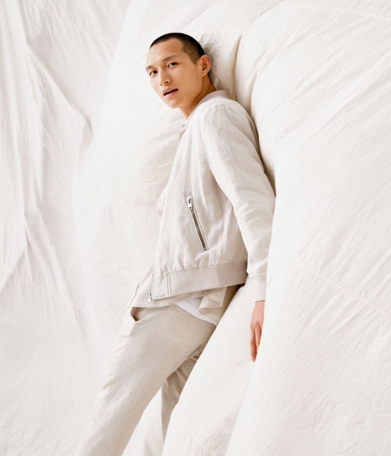 Front and center, Zhang Wenhui sports a linen bomber jacket with skinny fit suit pants by H&M.