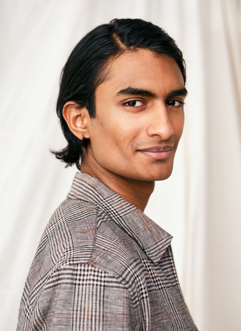 Charming with a smile, Robin Rishi models H&M's plaid linen-blend shirt jacket, or shacket.