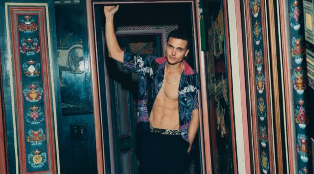 Karl Glusman Stars in Mr Porter Shoot, Talks Style & 'Devs' Posing in a charming room for Mr Porter, Karl Glusman dons a Sacai + Sun Surf camp-collar shirt with Dries Van Noten satin-trimmed trousers.