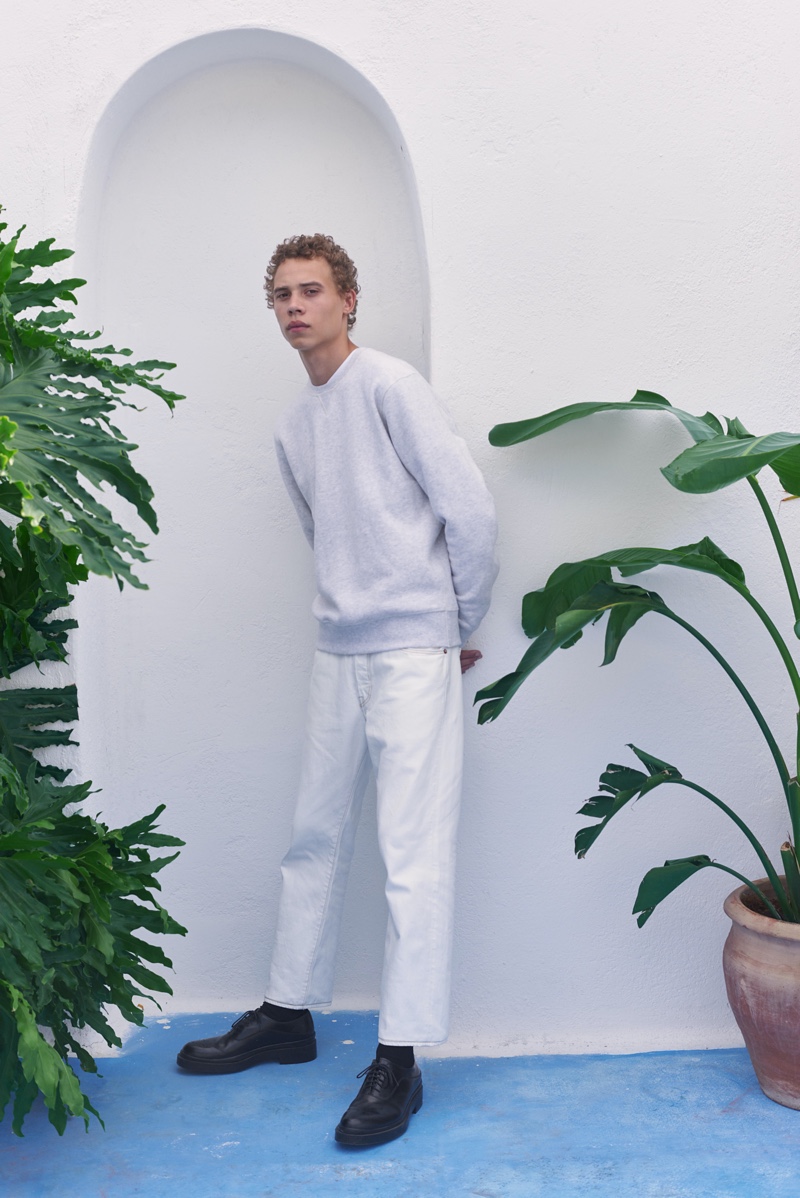 Making a case for light hues, Lye-Amone Cassac dons a sweatshirt and jeans from Levi's Made & Crafted.