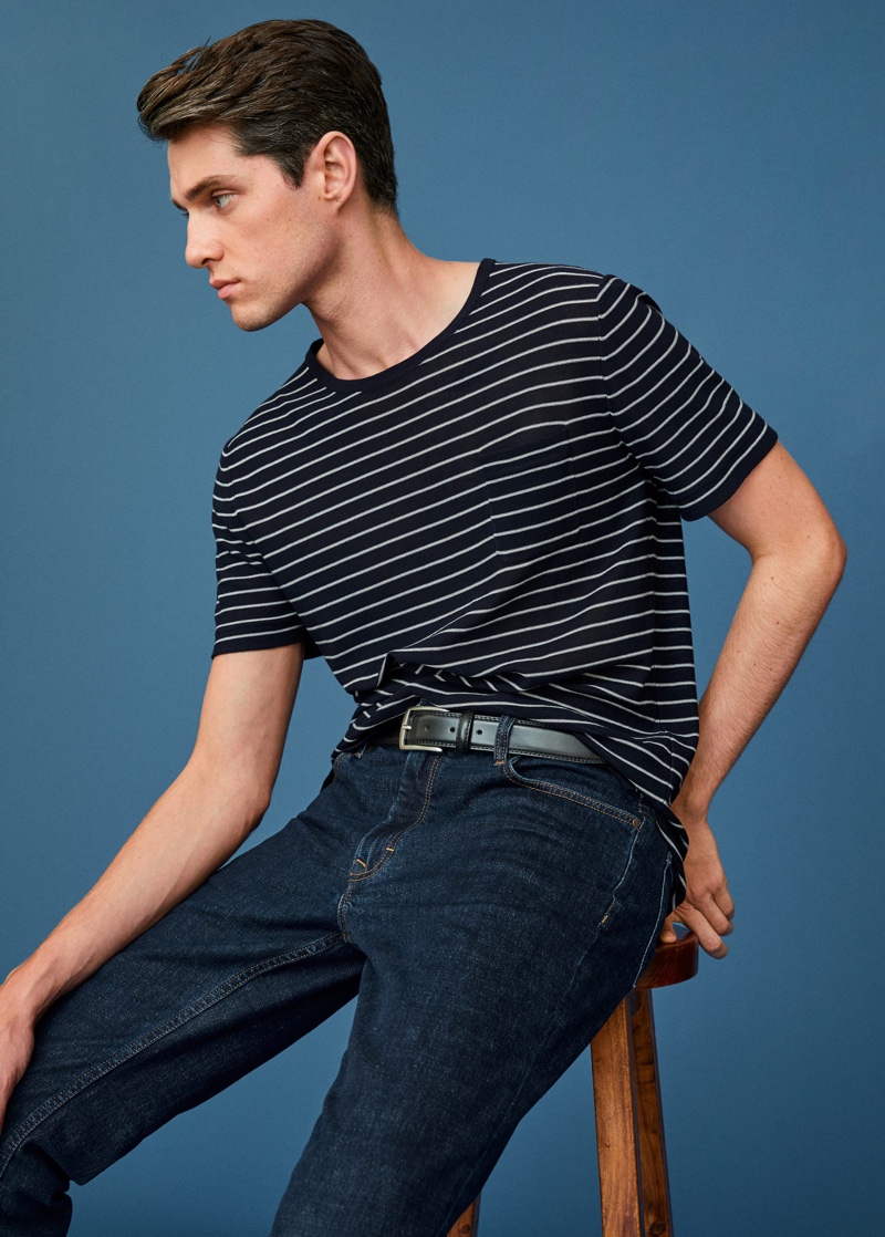 Connecting with Mango to showcase its latest men's arrivals, Luke Powell dons dark wash jeans with a striped t-shirt.