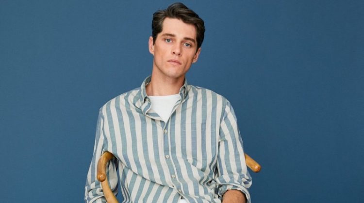 Luke Powell models a striped cotton shirt with regular fit jeans from Mango.