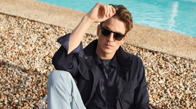 Hugo Sports Wardrobe Staples for Mango Relaxing poolside, Hugo Sauzay wears Mango's regular fit Bob jeans with a field jacket.