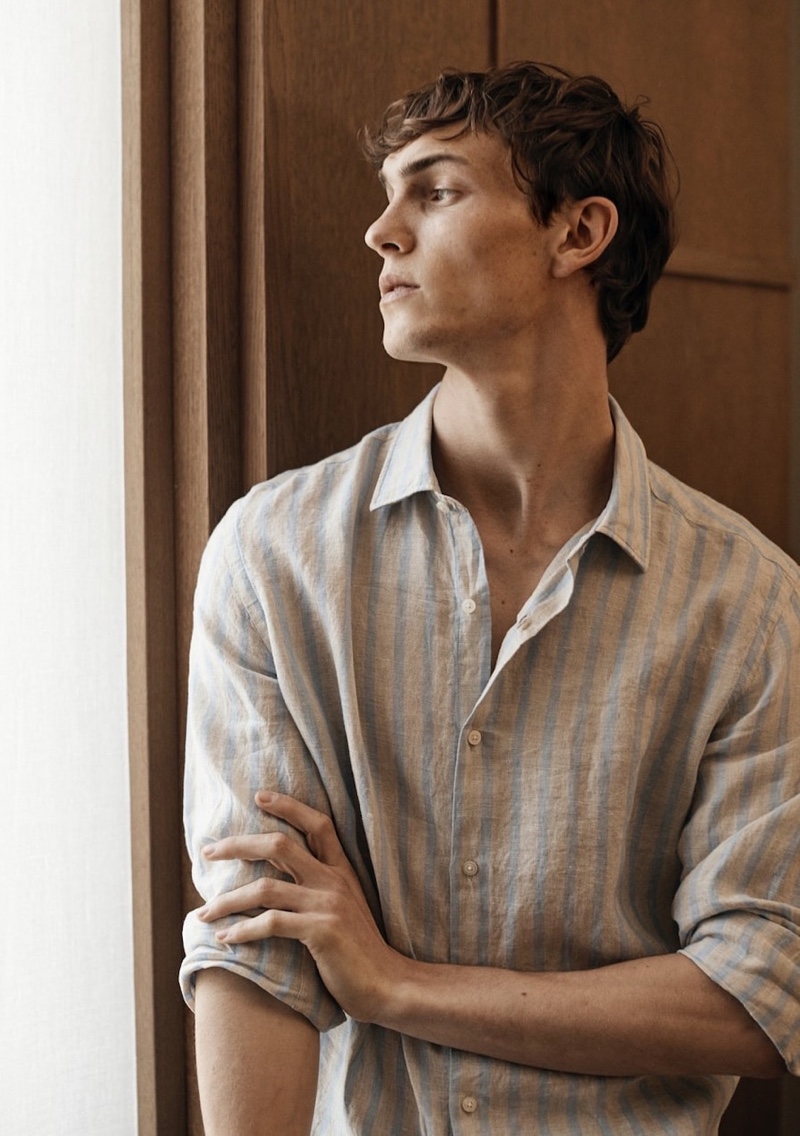 Luc Defont-Saviard sports a striped linen shirt from Massimo Dutti.