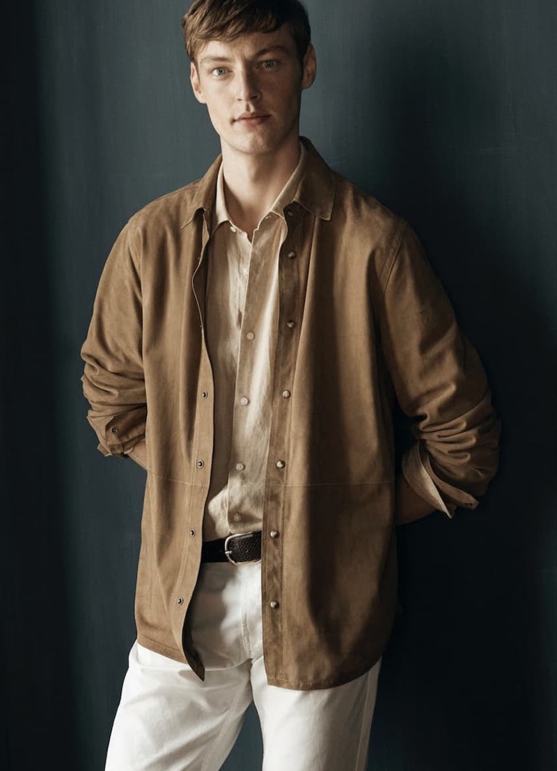 Front and center, Roberto Sipos models linen shirting with denim jeans by Massimo Dutti.