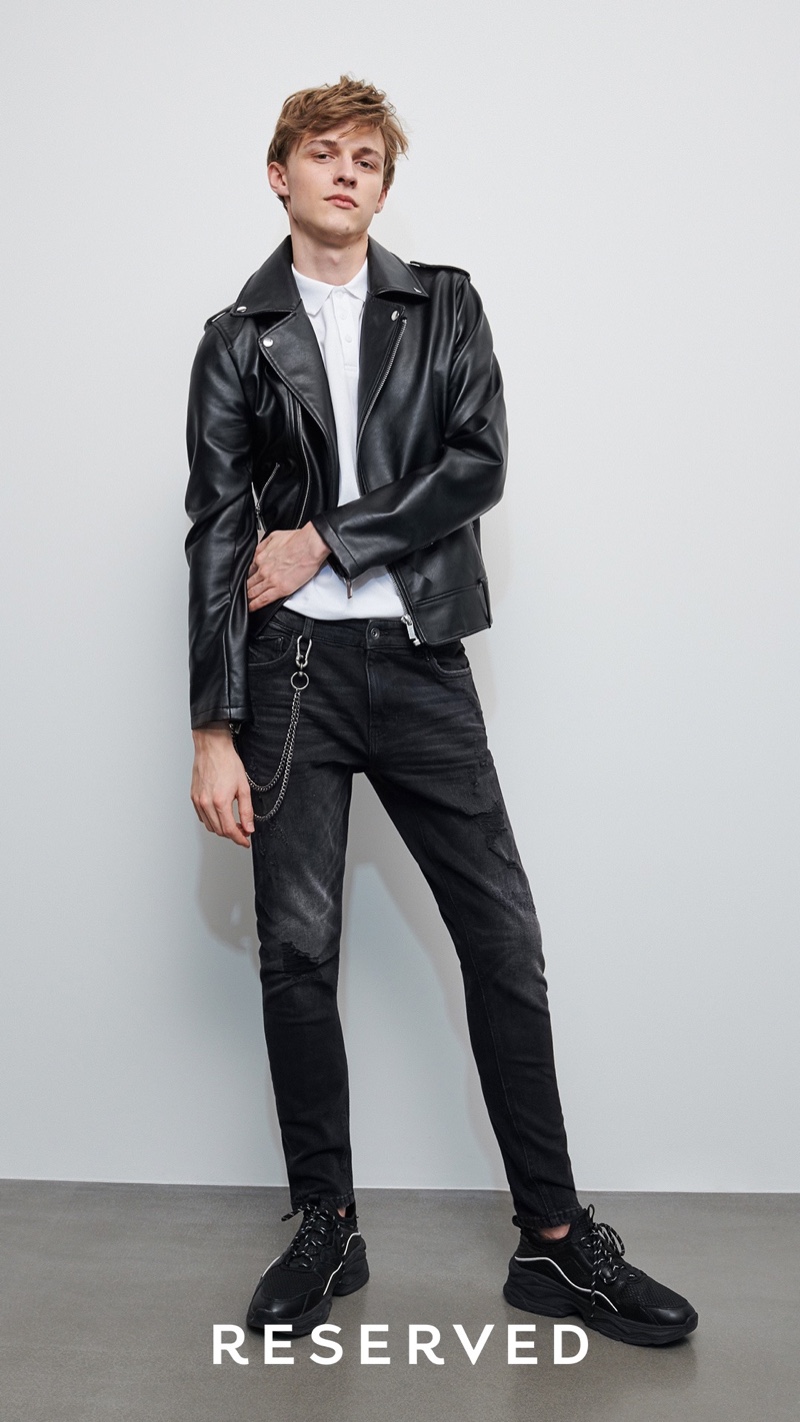 A cool vision in Reserved, Max Barczak rocks a biker jacket with black jeans, a wallet chain, and white shirt.