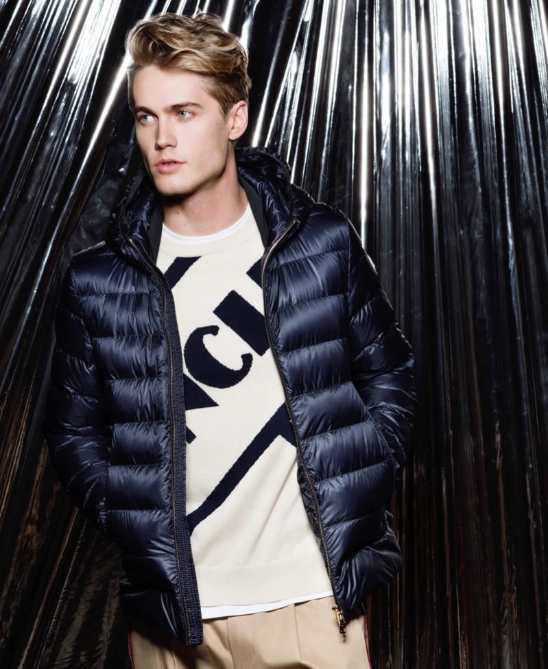 Front and center, Neels Visser dons a quilted jacket, sweater, and pants from Moncler for Holt Renfrew.