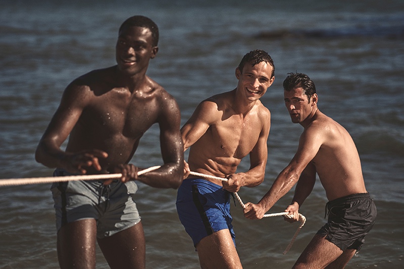 Playing a game of tug of war, Davidson Obennebo, Julian Schneyder, and Sean O'Pry front Orlebar Brown's spring-summer 2020 campaign.