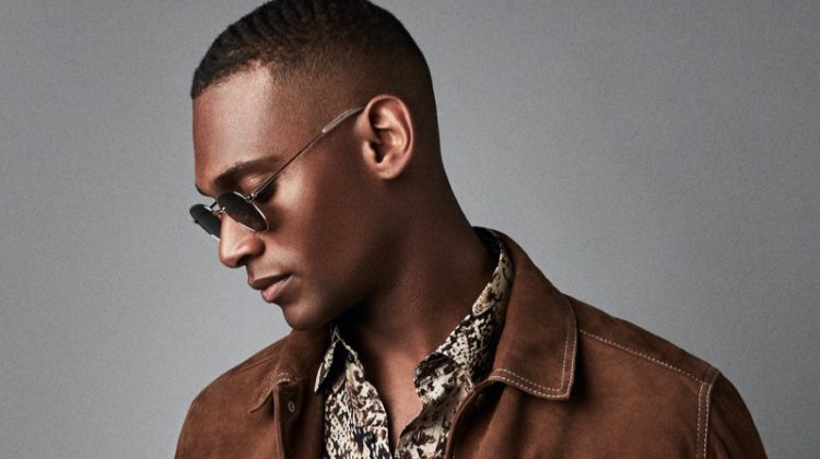 Embracing western style, Patrick Nodanche models a brown suede Hurst jacket from Reiss. He also rocks the brand's Adder snake print shirt with its Etna jeans and Rio sunglasses.