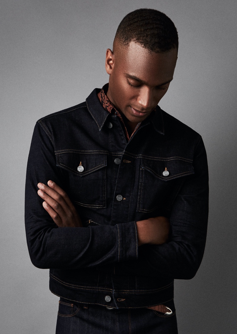 Model Patrick Nodanche rocks Reiss' four-pocket Chester denim jacket in indigo.