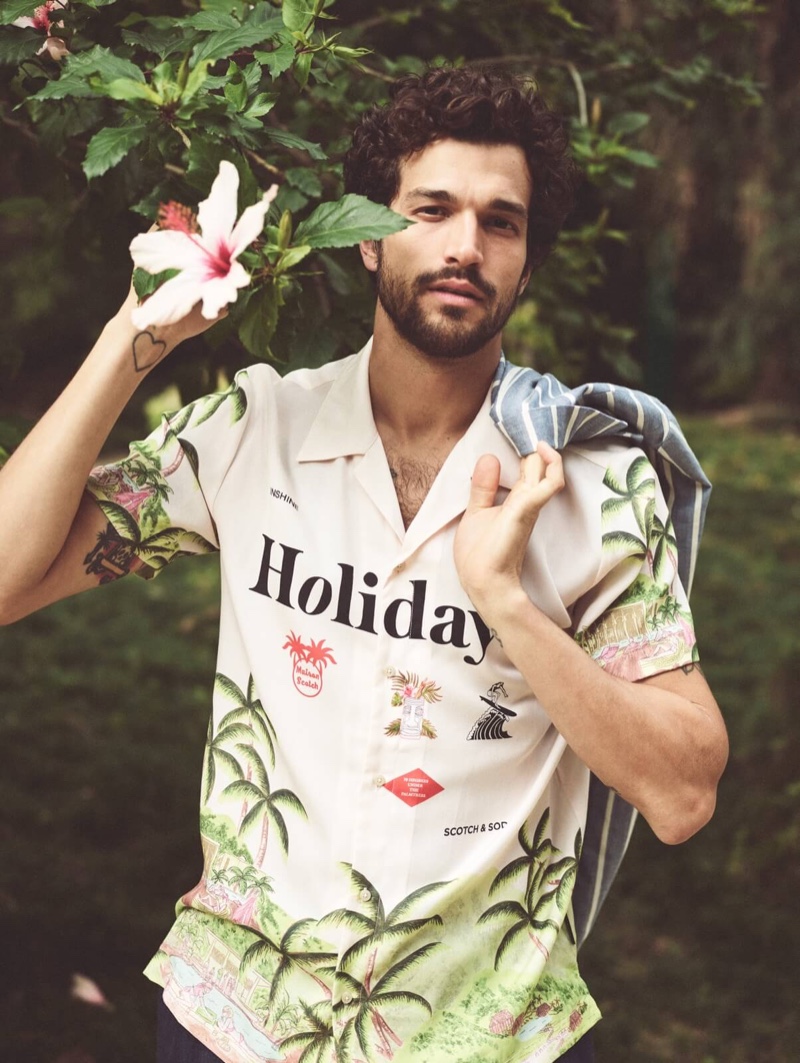 Paul Kelly models Scotch & Soda's Holiday print Hawaiian shirt.