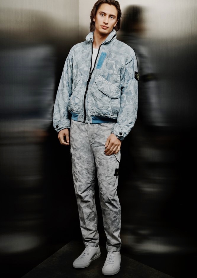 James Turlington rocks Stone Island's Big Loom Camo-TC jacket with cargo pants for Holt Renfrew.