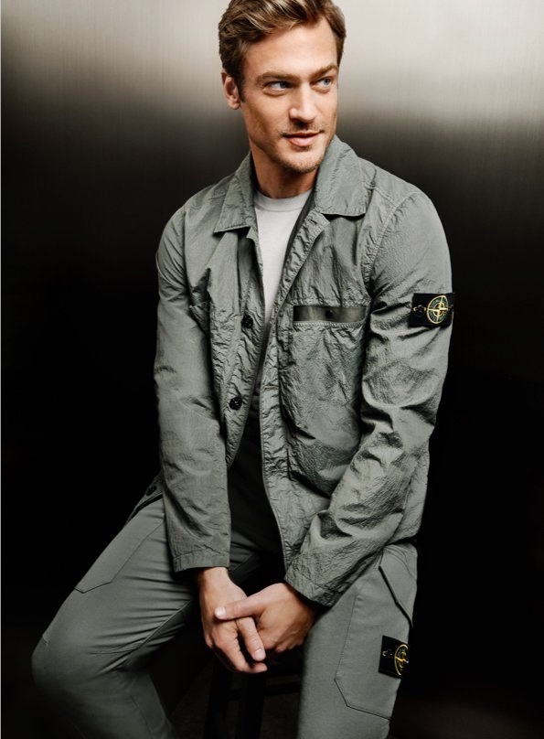 Jason Morgan models Stone Island's S.I. PA/PL Seersucker-TC jacket with cargo pants for Holt Renfrew.