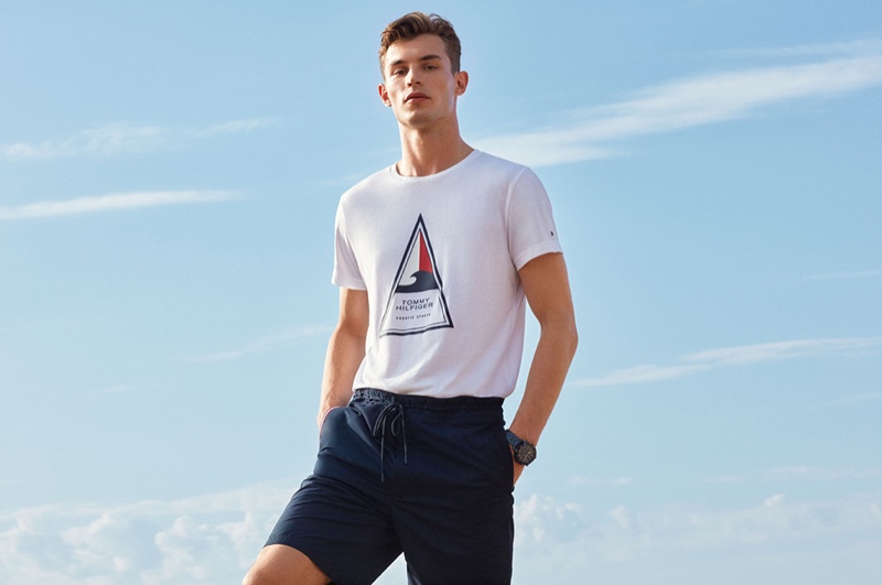 Taking to the beach, Kit Butler wears a Tommy Hilfiger look that features the brand's Bio Cool and Coolmax fabrics.