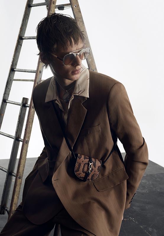 Pictured in a brown suit, Leon Dame appears in Zara's spring-summer 2020 campaign.