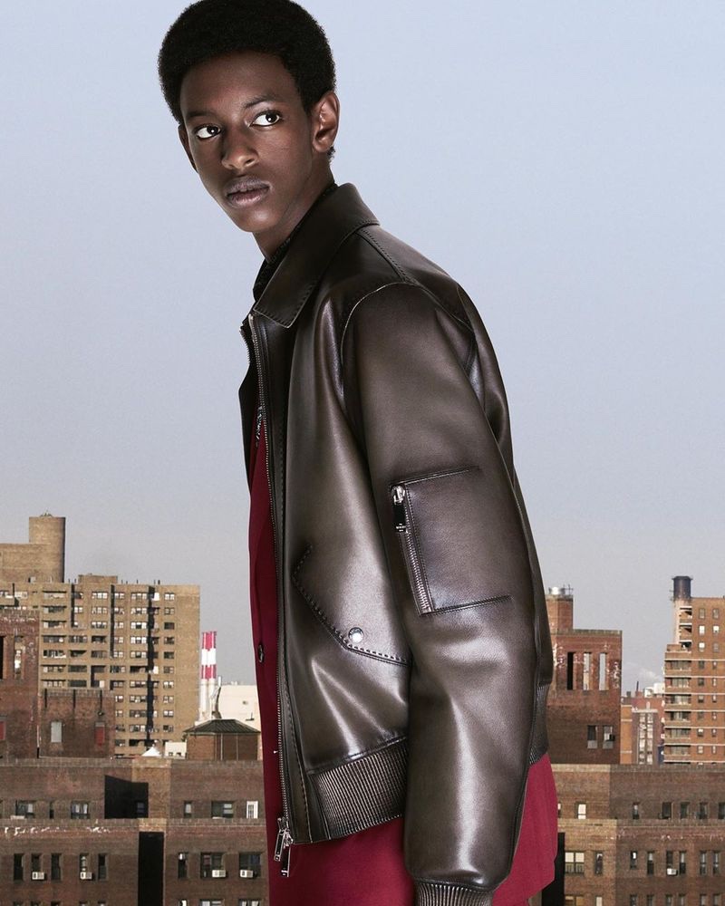 Craig Shimirimana stands out in a leather jacket from Berluti's pre-fall 2020 collection.