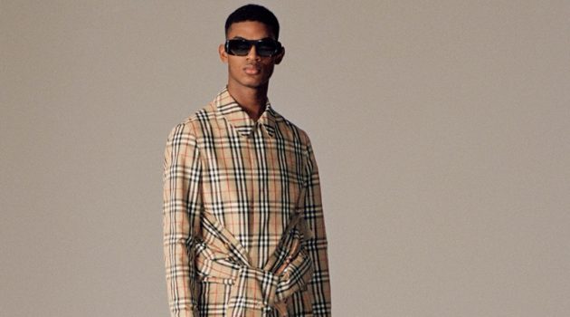 Burberry Goes Sustainable with ReBurberry Edit Donning Burberry's famous check, model Reece Nelson takes hold of the brand's logo print ECONYL tote.