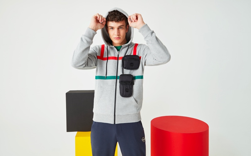 Embracing casual style, Aghiles Dahmani models a Research hoodie from Colmar's spring-summer 2020 collection.