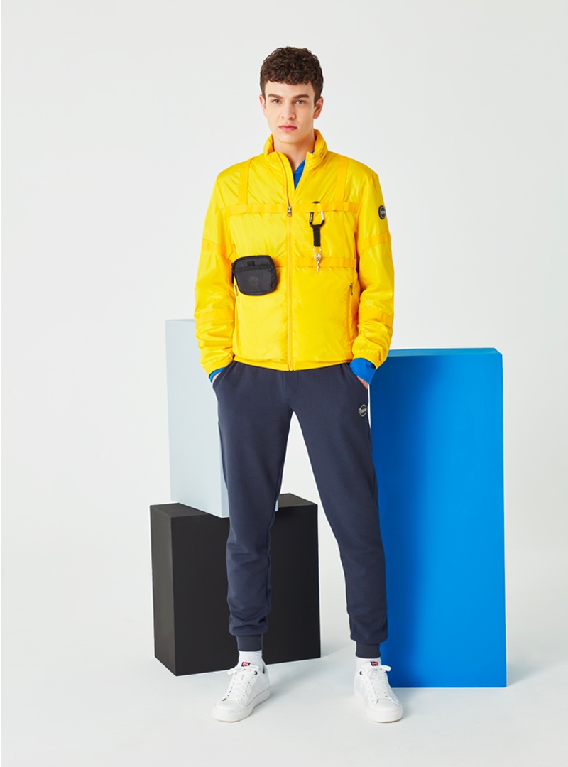 Aghiles Dahmani stands out in a colorful yellow Research jacket from Colmar's spring-summer 2020 collection. » Colmar Explores the Dynamism of Stillness with Spring '20 Campaign Aghiles Dahmani stands out in a colorful yellow Research jacket from Colmar's spring-summer 2020 collection.