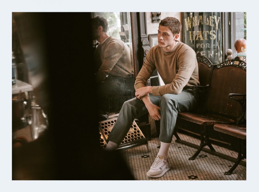 Model Paul Fontanier dons a crewneck sweatshirt and tapered pants by Maison Kitsune for East Dane.