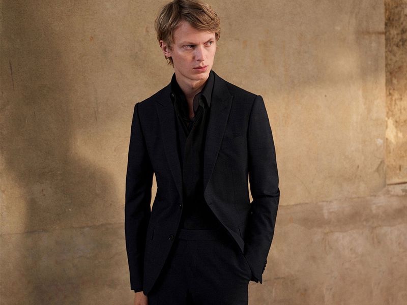 German model Jonas Glöer sports a black suit from Ermenegildo Zegna Made to Measure.