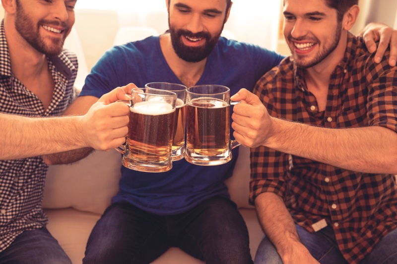 Group Men Drinking Beer Mugs Couch