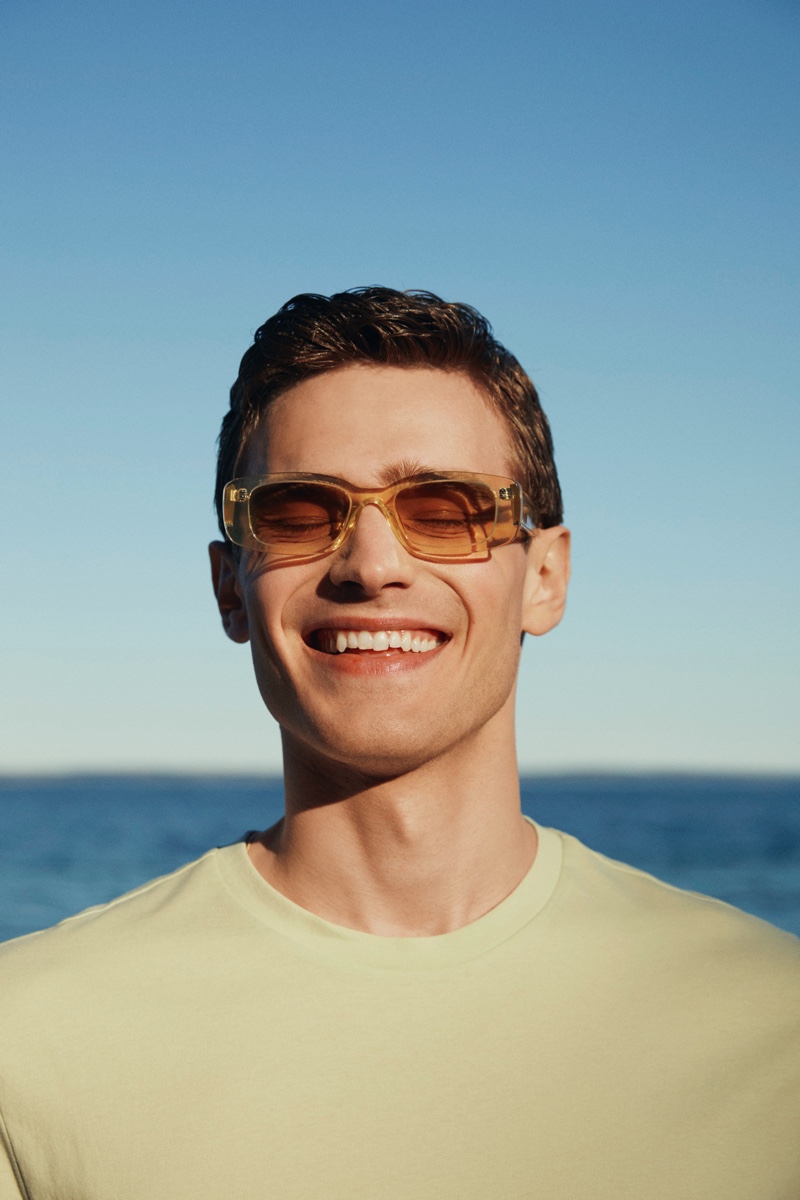 All smiles, Bo Develius wears modern shades from the H&M x CHIMI collaboration.