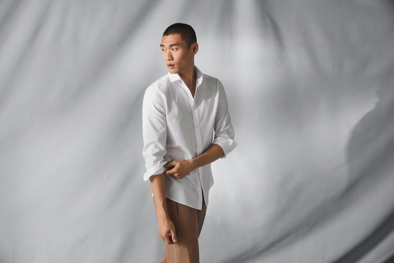 Kamui Tanaka dons a crisp white shirt that uses H&M's Coolmax fabric technology. 