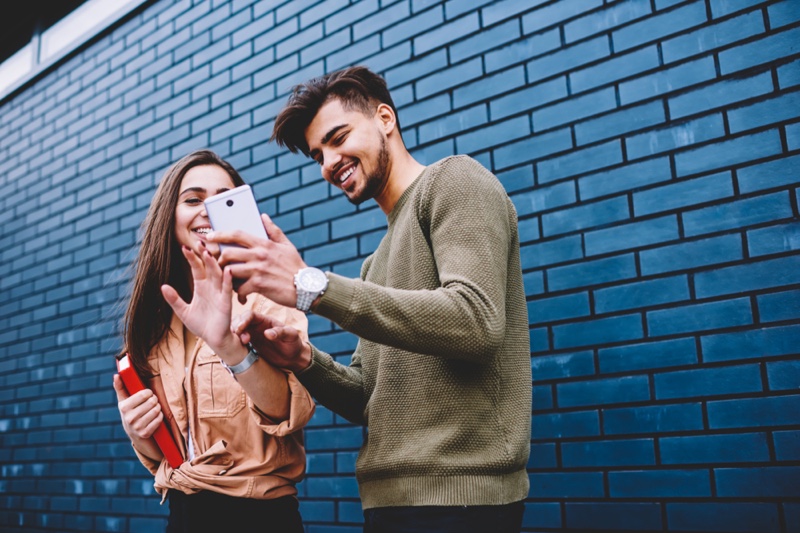 Man Woman Looking Phone Smiling