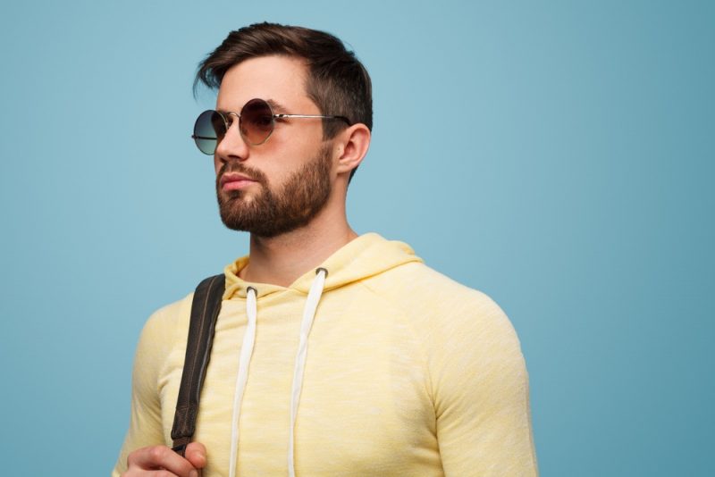 Man in Yellow Hoodie and Sunglasses