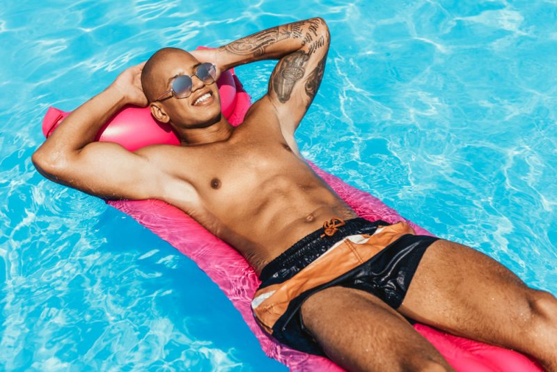 Man with Six-Pack Relaxing in Pool