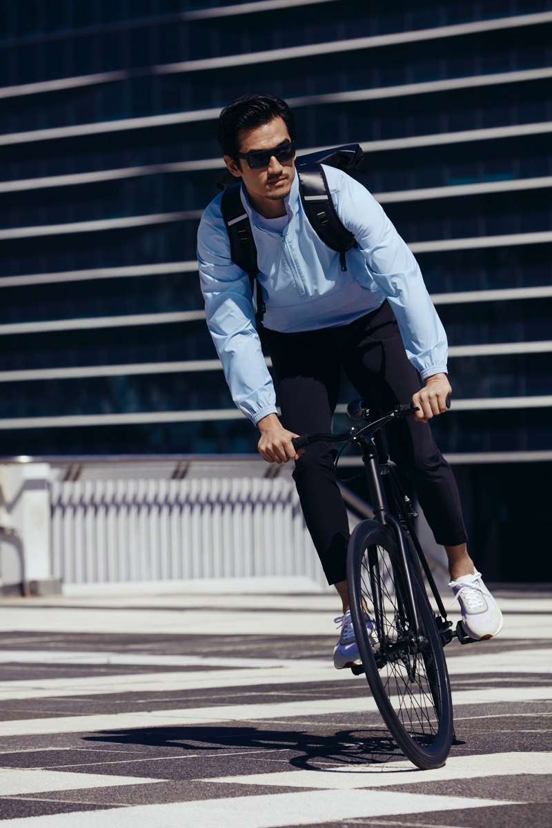 On the move, riding a bike, Tony Chung stars in Mango's Improved collection campaign.