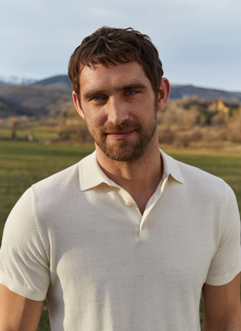 Will Chalker sports a knit cotton polo shirt by Mango.