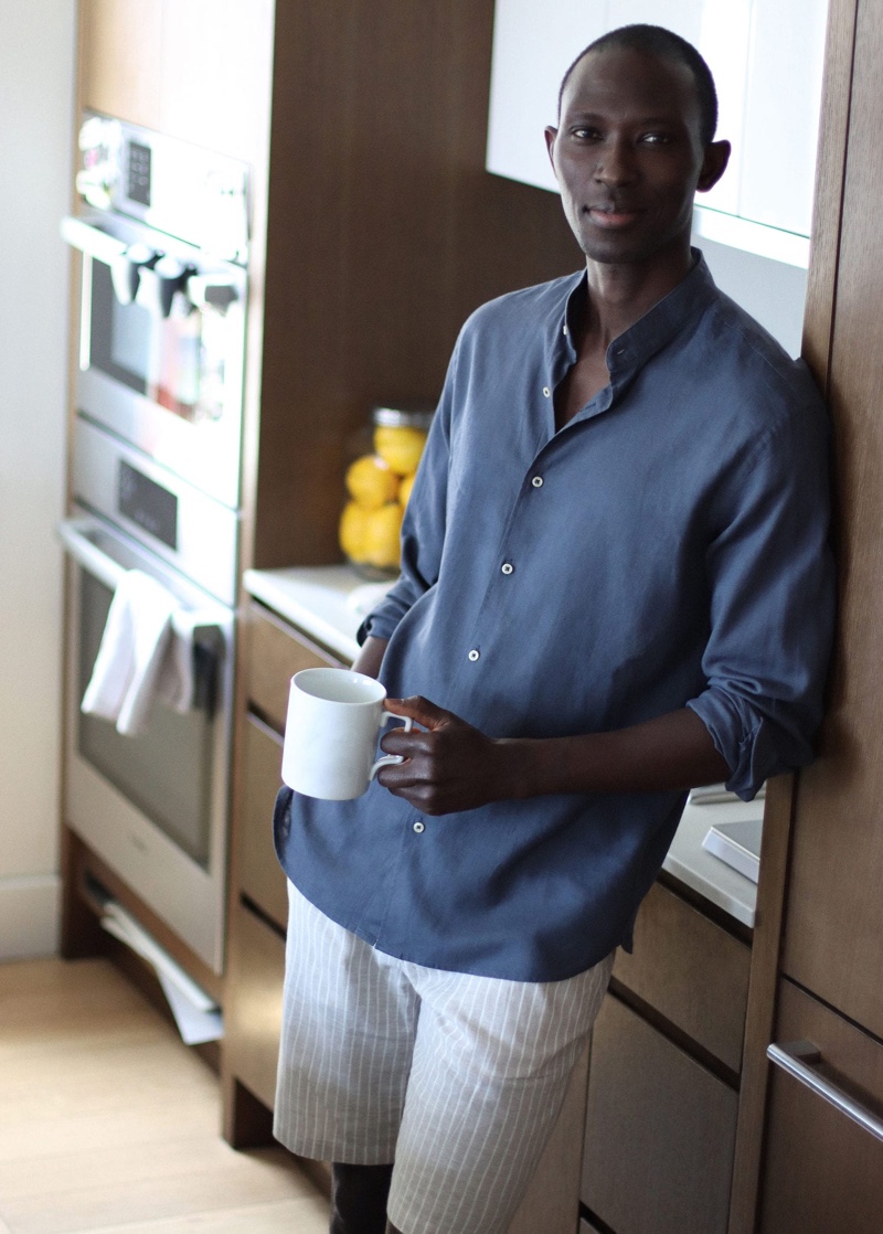 Model Armando Cabral sports Mango's printed linen-cotton blend Bermuda shorts with a regular-fit linen shirt.