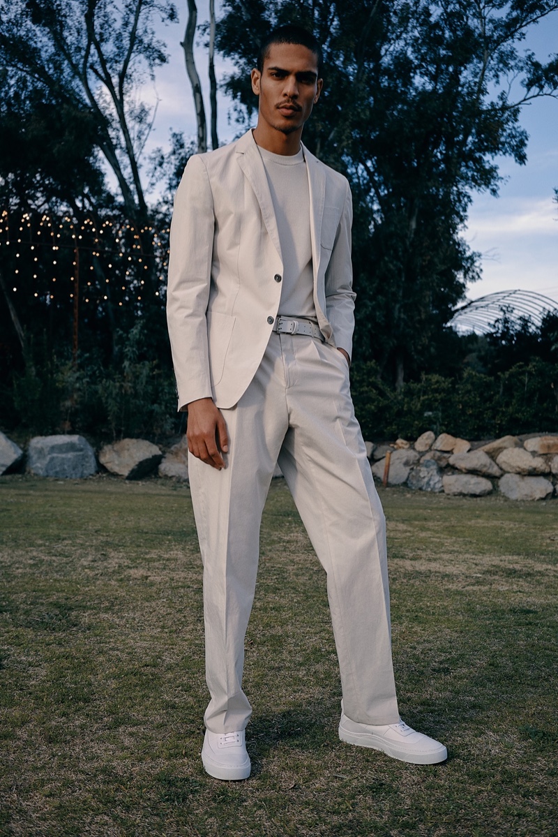 Geron McKinley makes a chic summer statement in a pale gray suit by BOSS.