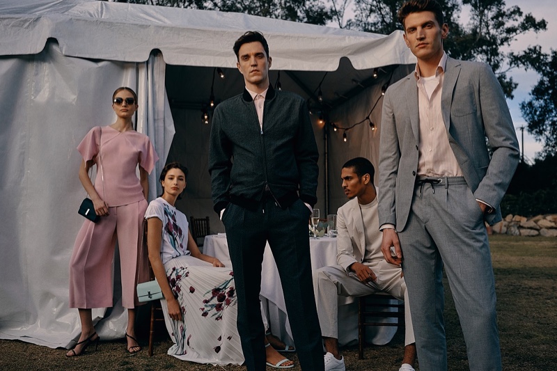 Models Josh Beech, Geron McKinley, and André Feulner sport summer tailoring from BOSS.