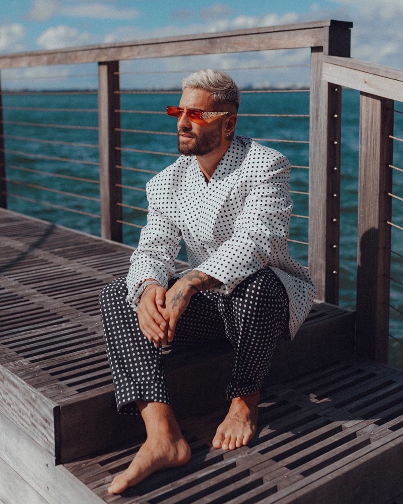 Maluma embraces Parisian style in a polka dot look for Balmain's resort 2021 campaign.