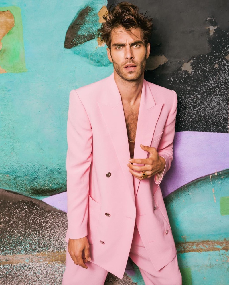 Jon Kortajarena channels Miami Vice style in a pink double-breasted suit for Balmain's resort 2021 campaign.