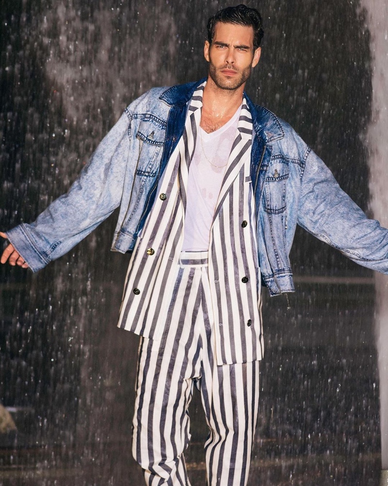 Miami Vice meets the Fresh Prince of Bel-Air as Jon Kortajarena dons a striped suit with a denim jacket for Balmain's resort 2021 campaign.