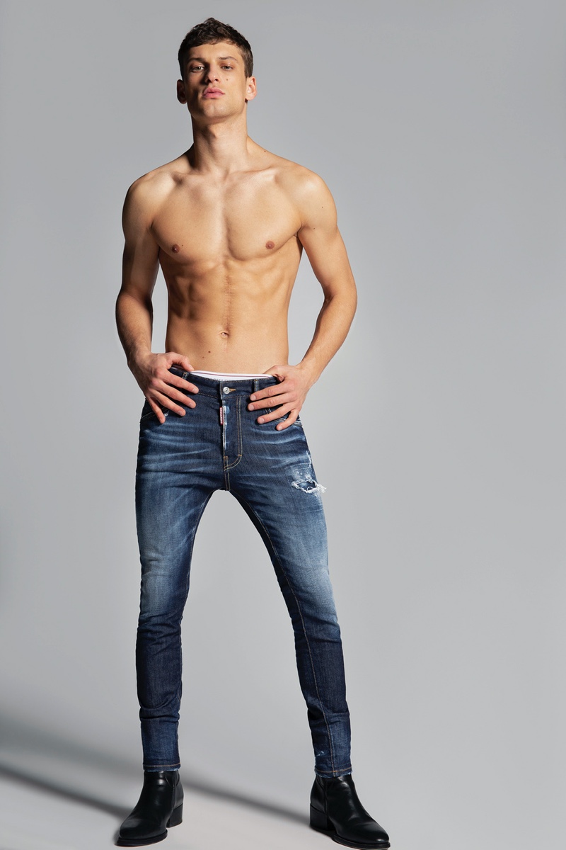 Front and center, David Trulik wears Dsquared2's dark wash Super Twinky jeans.