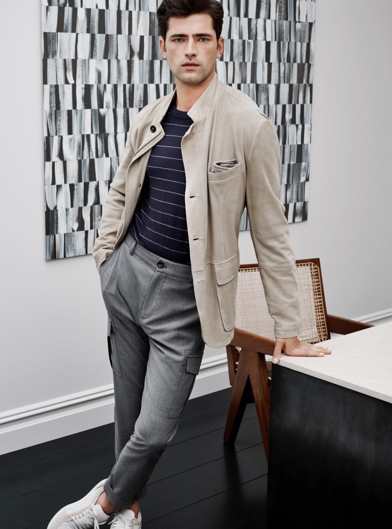 Sean O'Pry sports a striped wool sweater, stretch wool cargo pants, and sneakers from Eleventy.