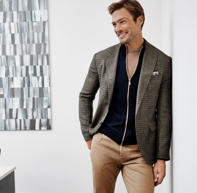 Going smart-casual, Jason Morgan models a linen-wool blend sport coat with a merino-blend sweater and washed cotton jeans by Eleventy.