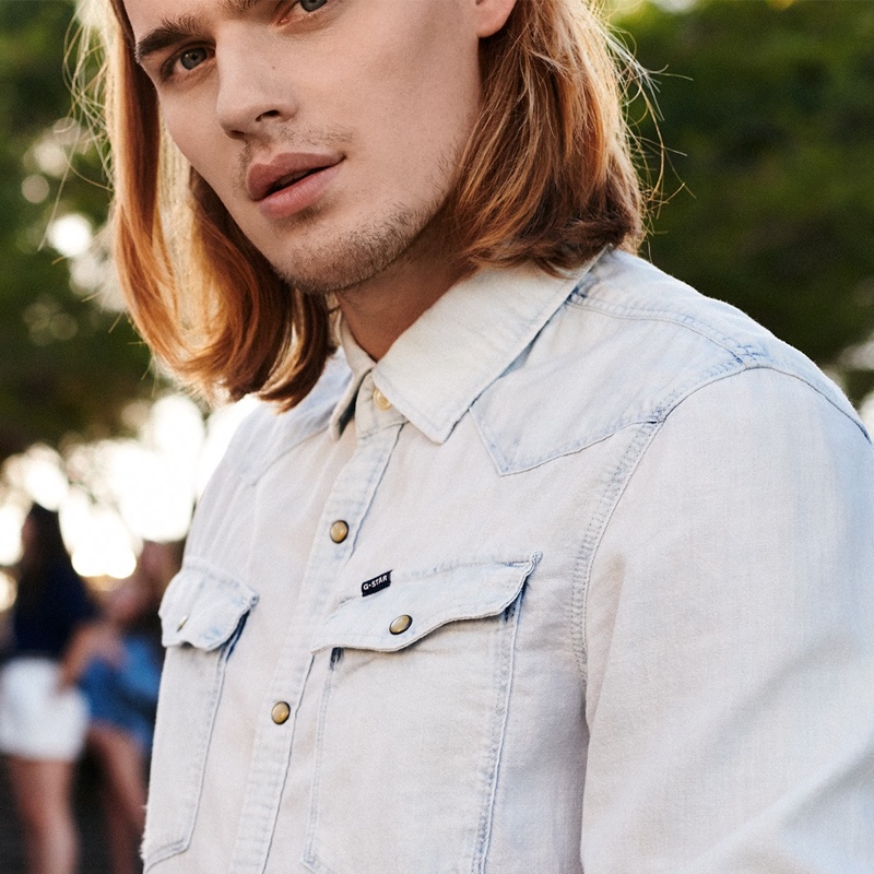 Dutch model Ton Heukels wears a light-colored denim jacket for G-Star Raw's spring-summer 2020 campaign.
