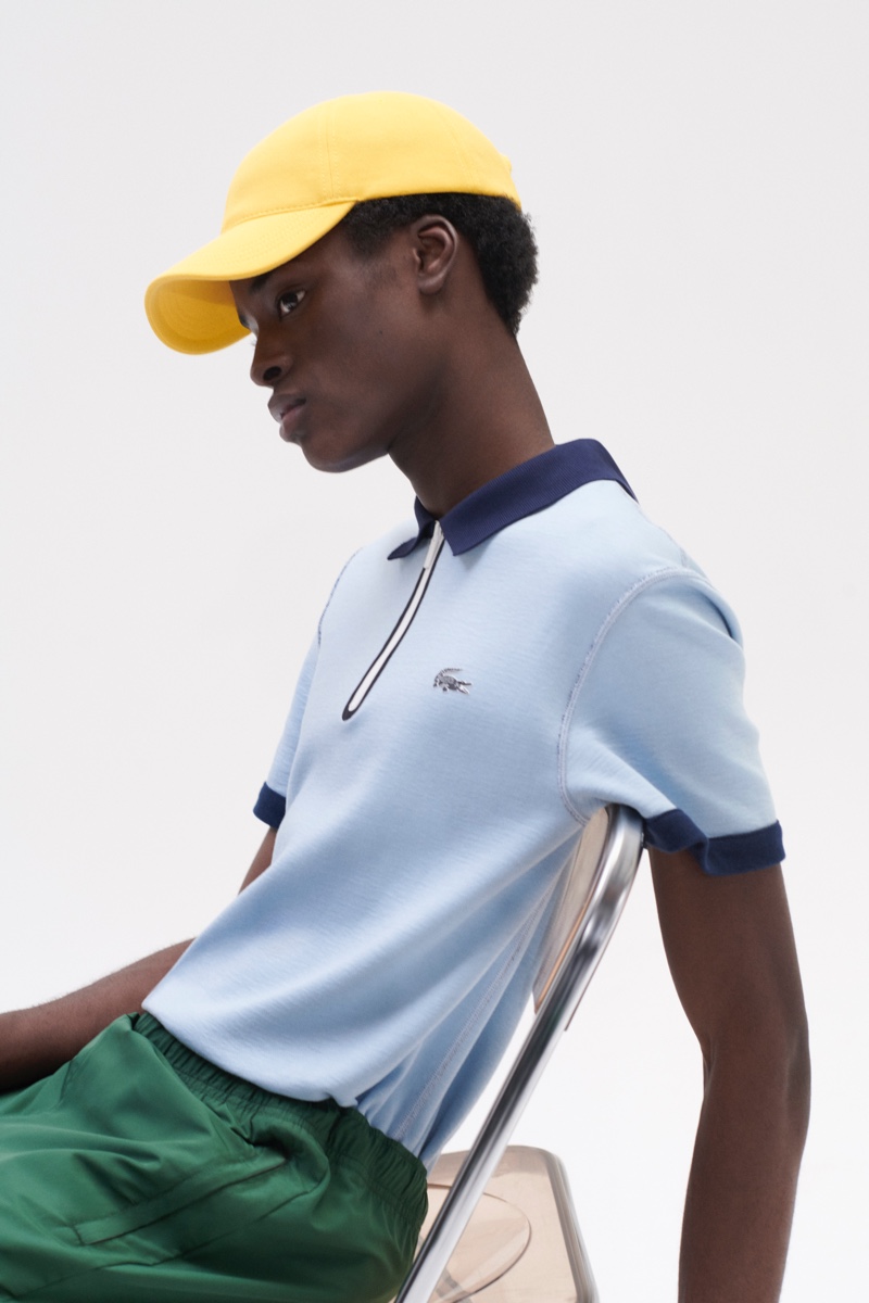 Babacar N’doye models a sky blue polo shirt from Lacoste's fall-winter 2020 collection.